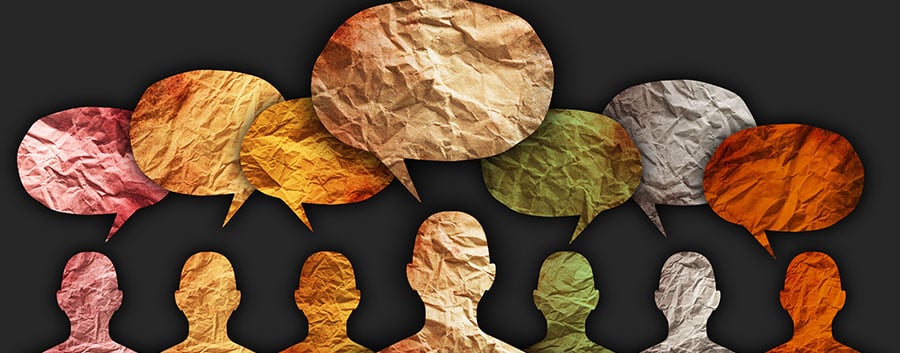 Silhouettes of people with colorful speech bubbles above them, suggesting conversation or dialogue.