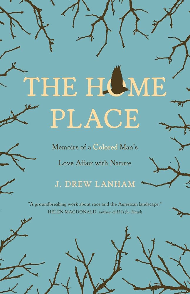 Book cover for "The Home Place: Memoirs of a Colored Man's Love Affair with Nature" by J. Drew Lanham, featuring a blue background with brown tree branches and a flying bird silhouette.